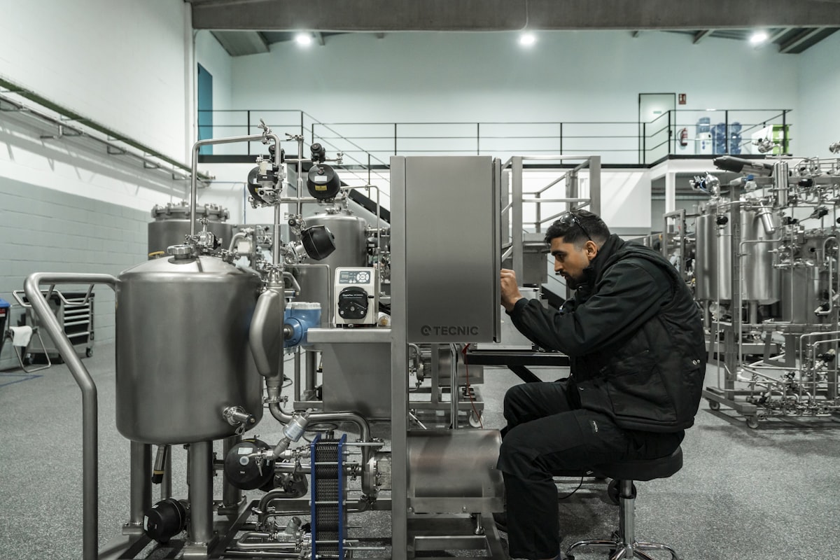Technician inspecting an industrial motor before shipment